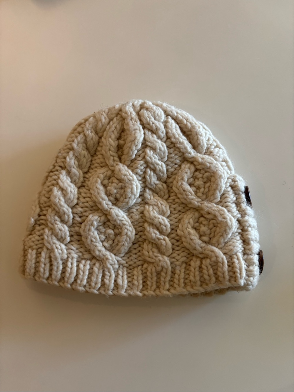 Women’s Cream Wool Blend Cable-Knit Beanie with Side Button Detail